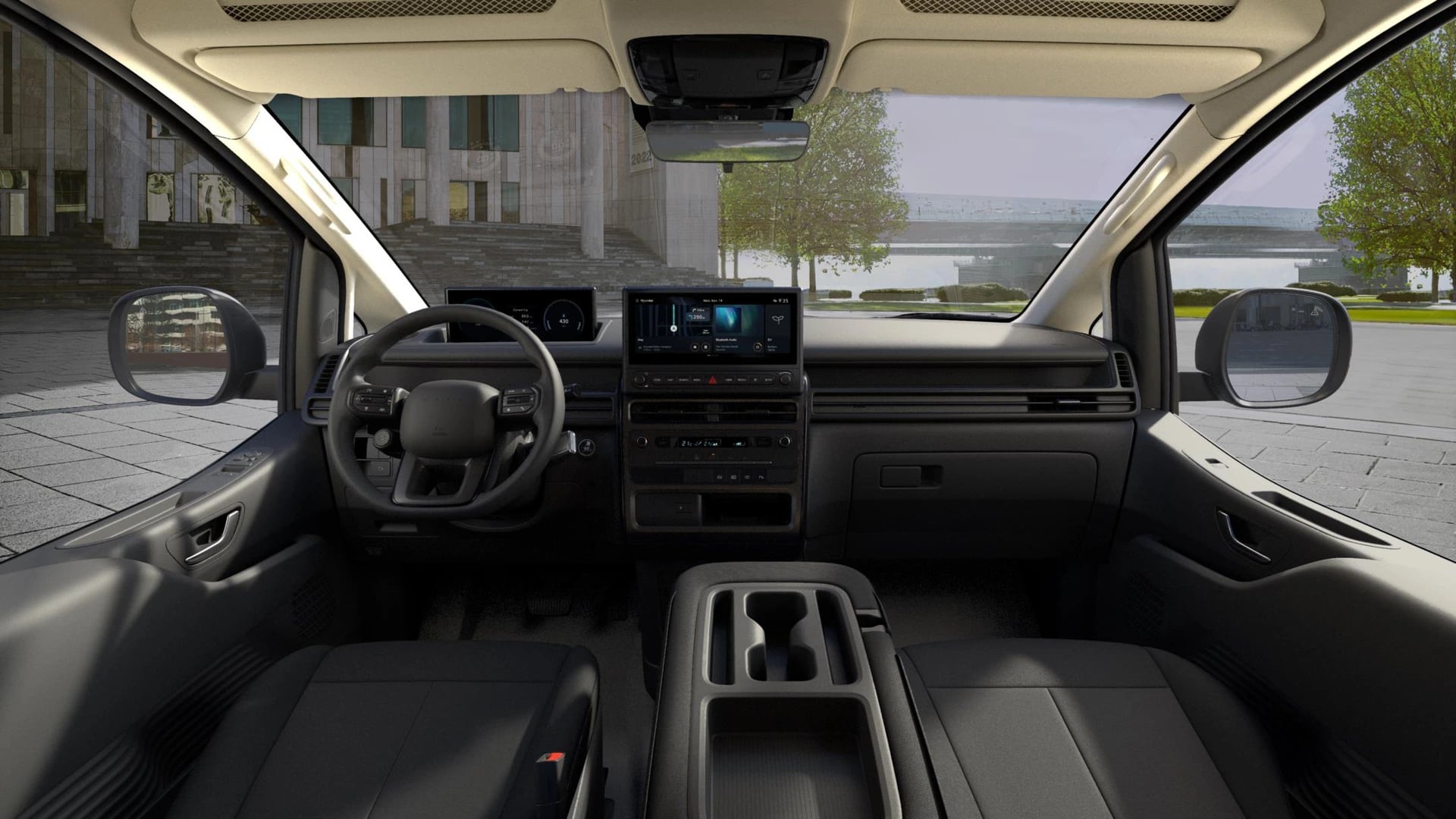 Förarmiljön i Hyundai STARIA Cargo med ratt, digitalt instrumentkluster och 12,3-tums pekskärm